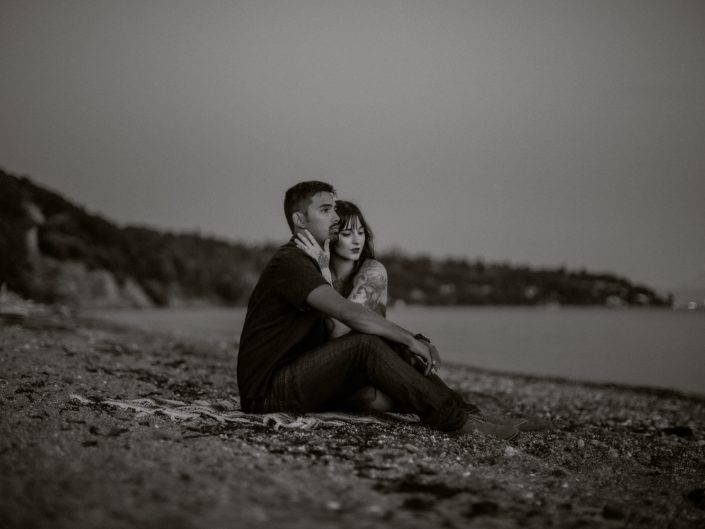 man and woman on beach in black and white